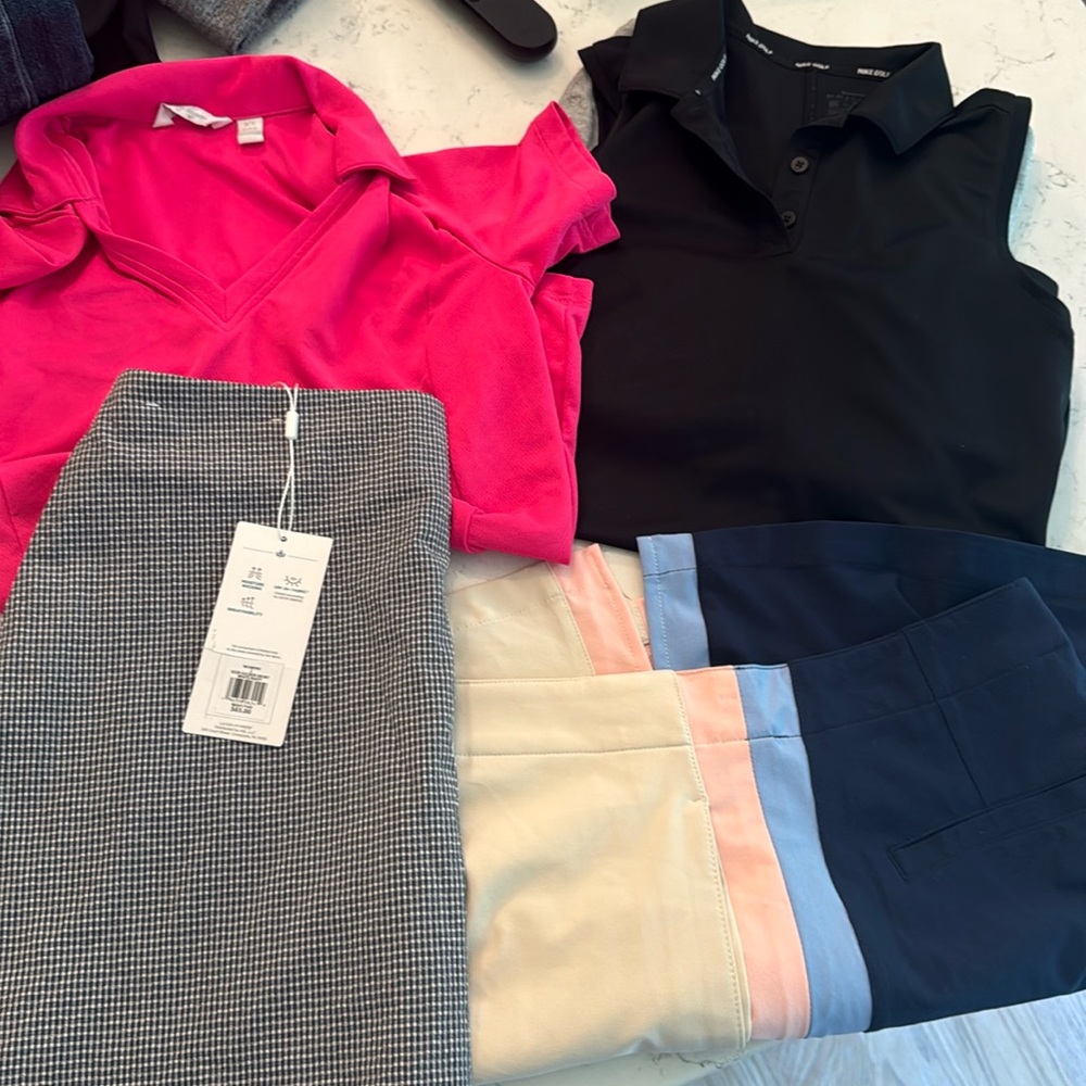 Golf skorts (skirt with shorts built in) and collared shirts. Sold as a bundle.
